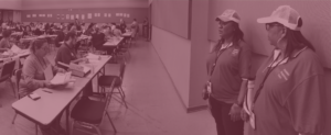 Two USDA Disaster Assistance employees inspect a processing center.